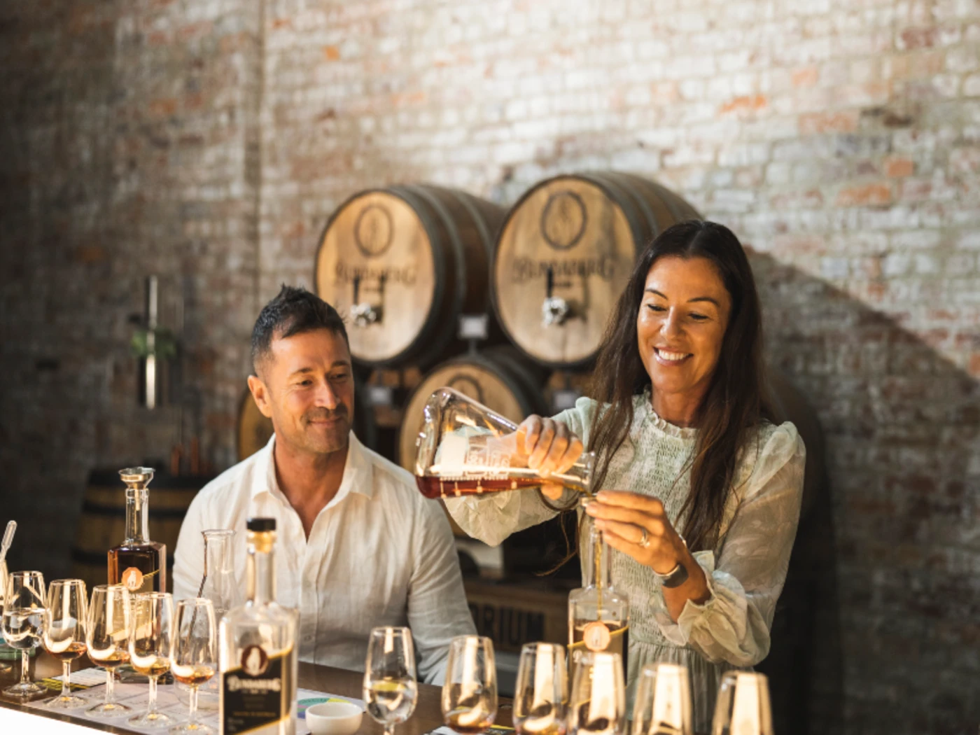 Two people tasting samples at the Bundaberg rum distillery
