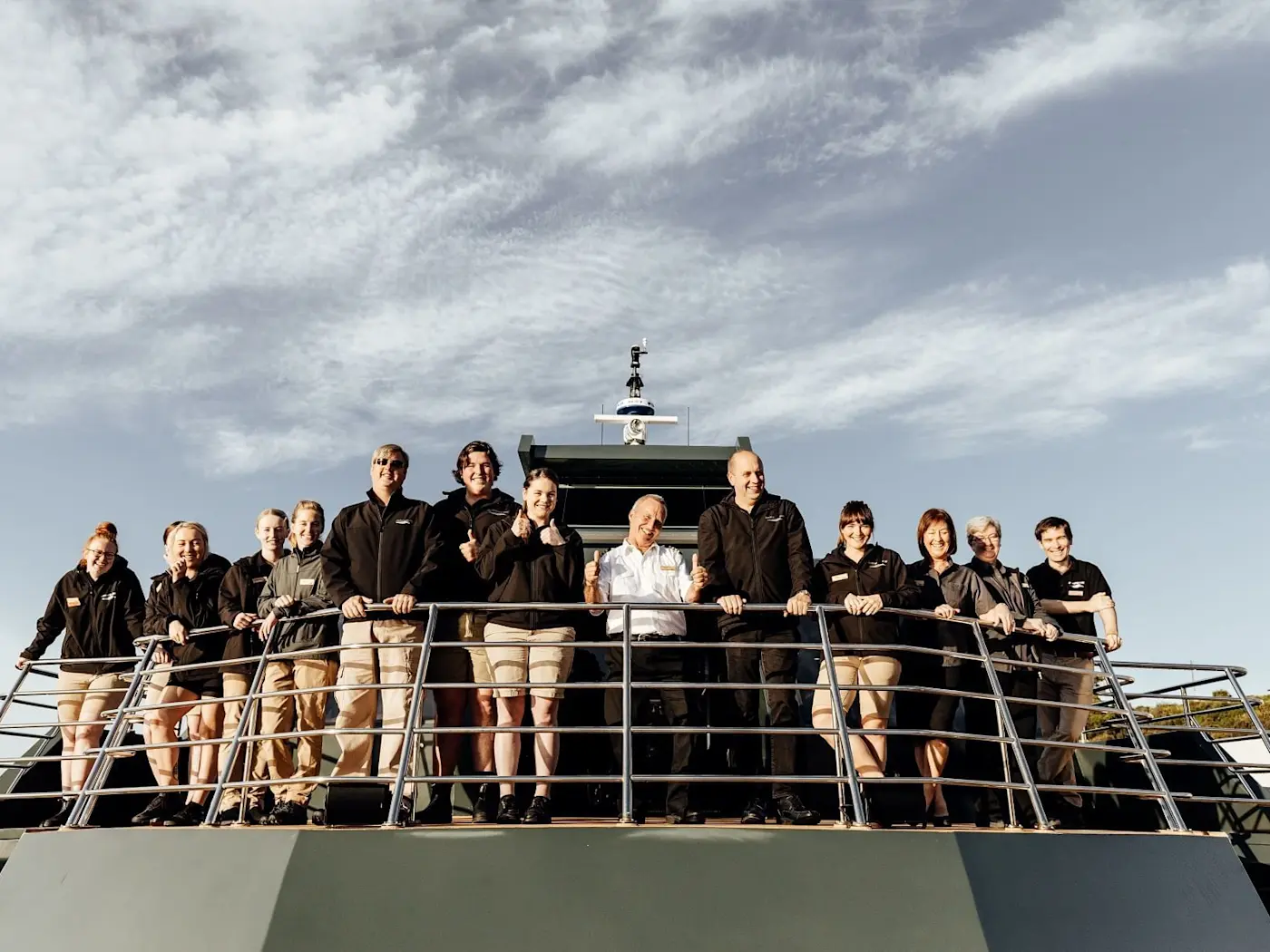 Cabin crew posing on a boat at Gordon River Cruise
