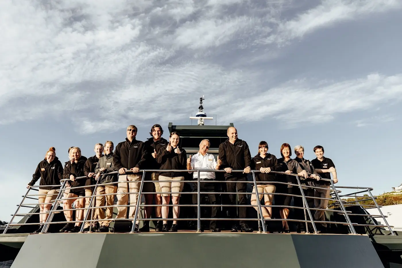 Cabin crew posing on a boat at Gordon River Cruise