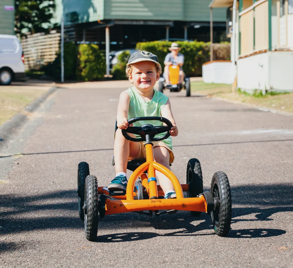 Child on go kart, NRMA Toowoon Bay Holiday Park, Central Coast