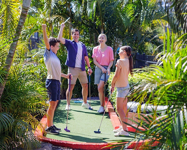 Family playing miniature golf at Treasure Island Gold Coast holiday park
