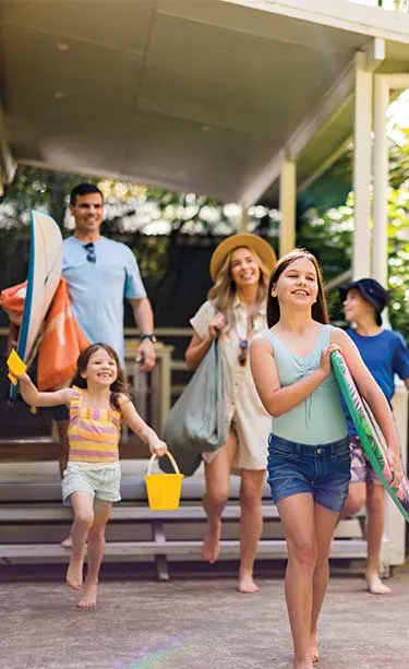 Family staying in a cabin at a NRMA holiday park