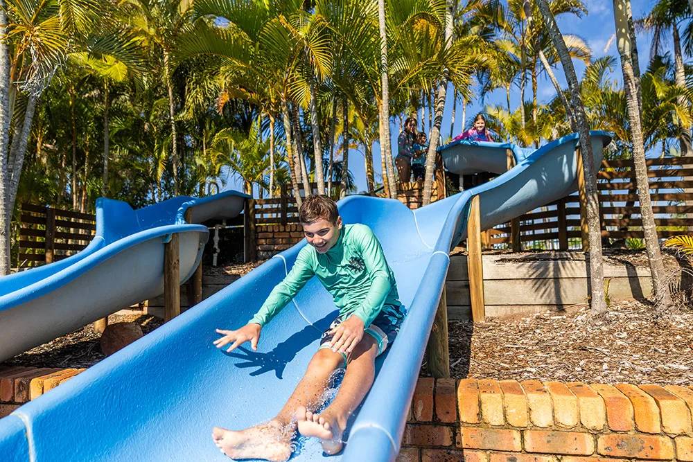 Boy going down waterslide NRMA