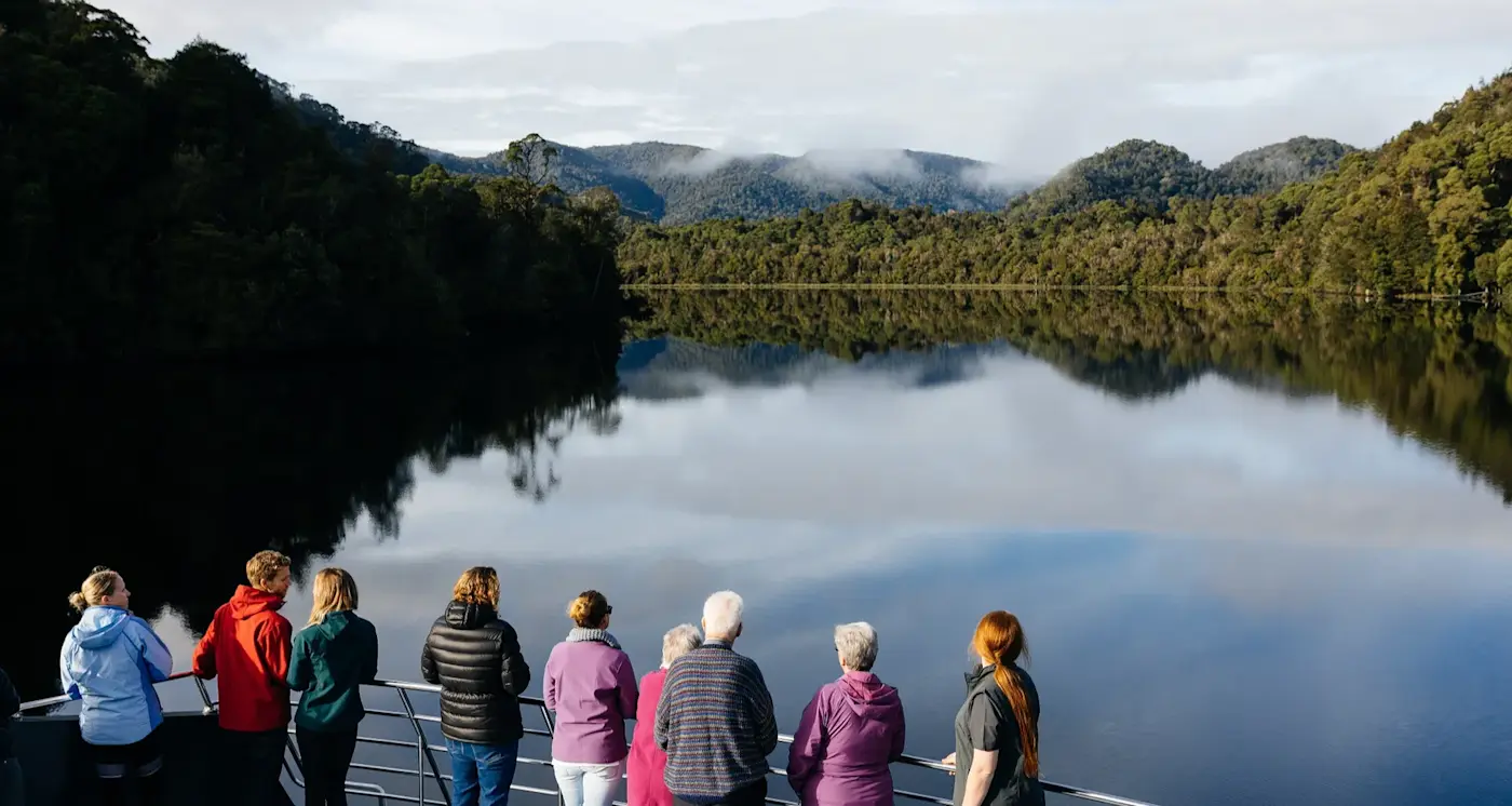 People enjoying the view from the cruise near Strahan Village