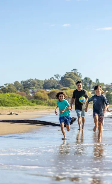 Family on the beach near NRMA Batemans Bay Holiday Resort