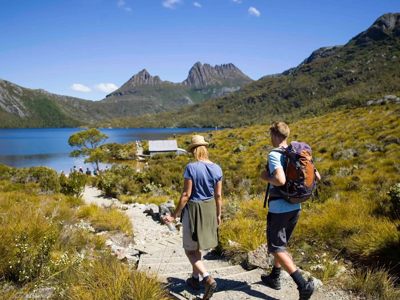 Couple walking on Dove Lake Circut near Cradle Mountain Hotel 