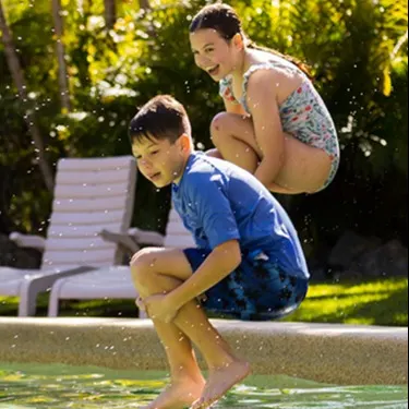 family playing in pool at NRMA Parks and Resorts
