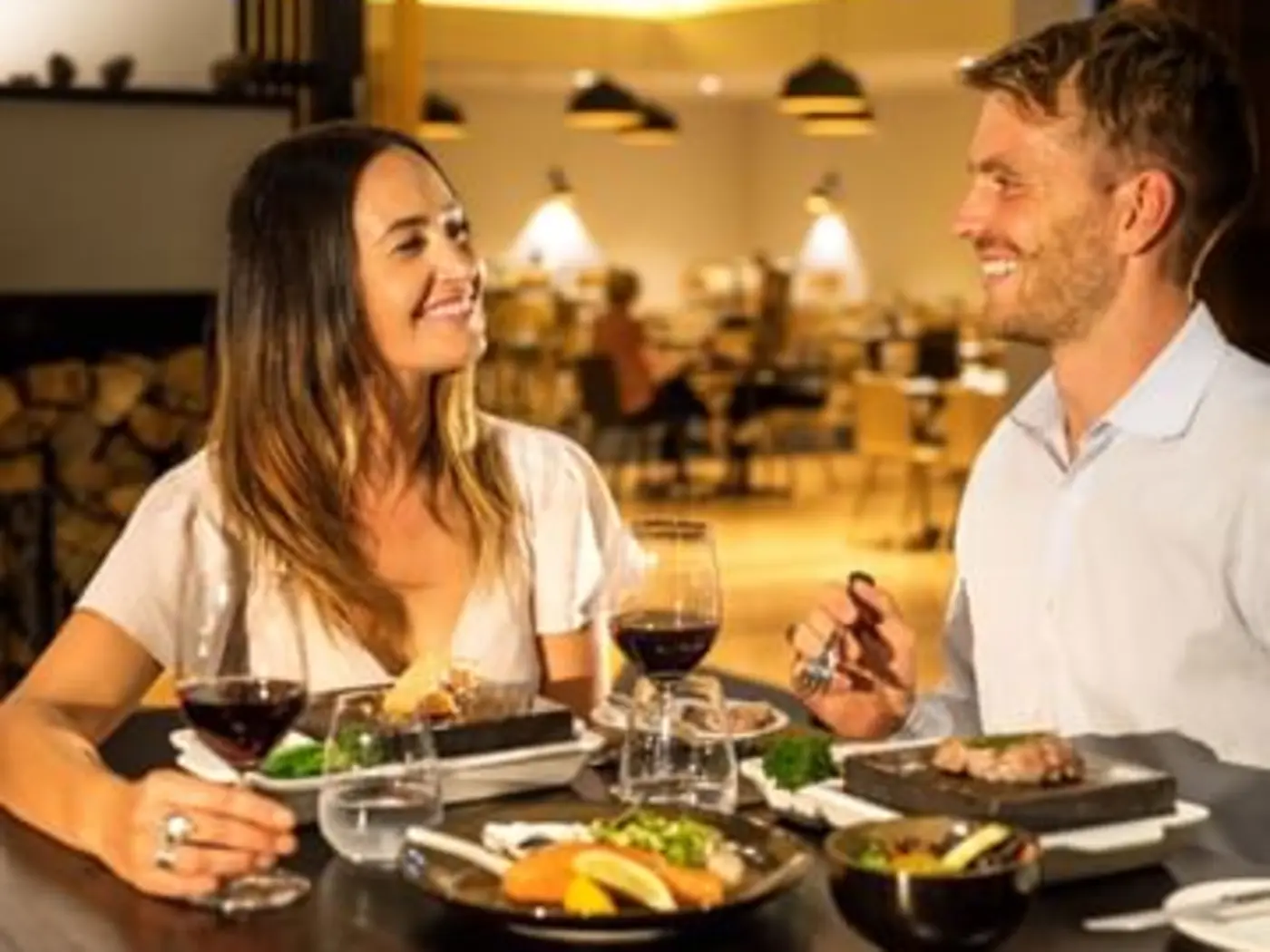 Couple having meal at the restaurant at Cradle Mountain Hotel