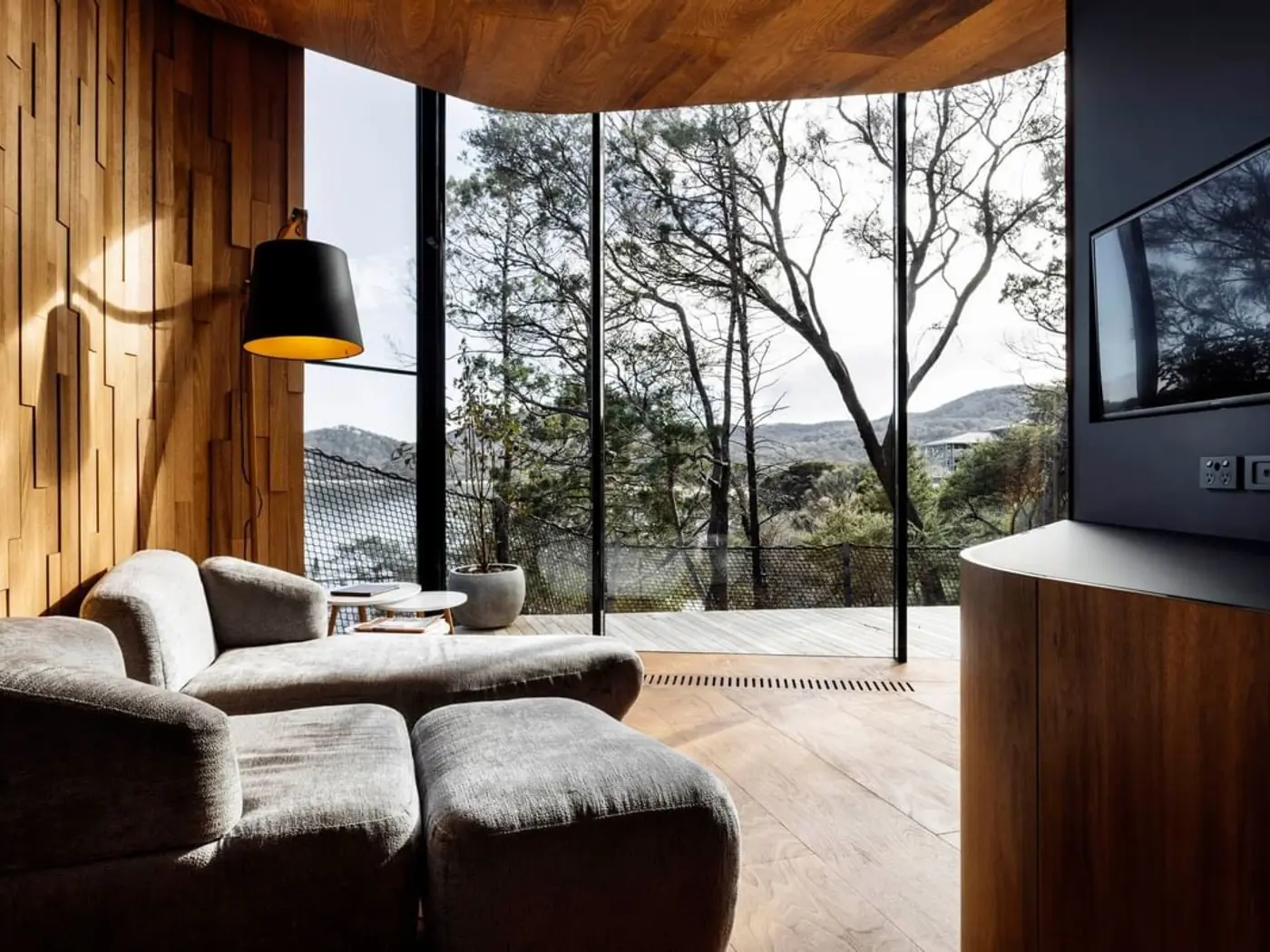 Living area with a mountain view in Coastal Pavilion at Freycinet Lodge