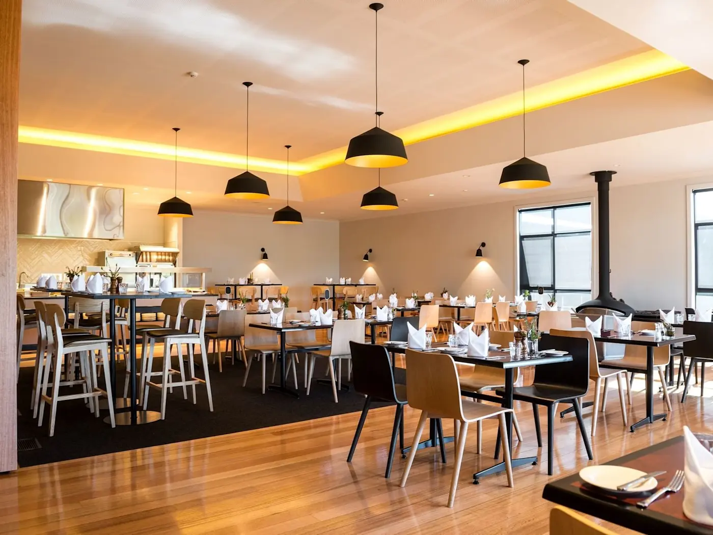 Dining tables arranged in Altitude Restaurant at Cradle Mountain Hotel