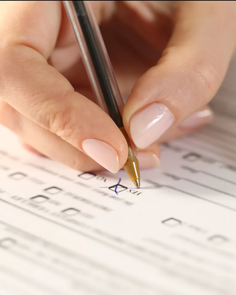 woman filling out a new patient form