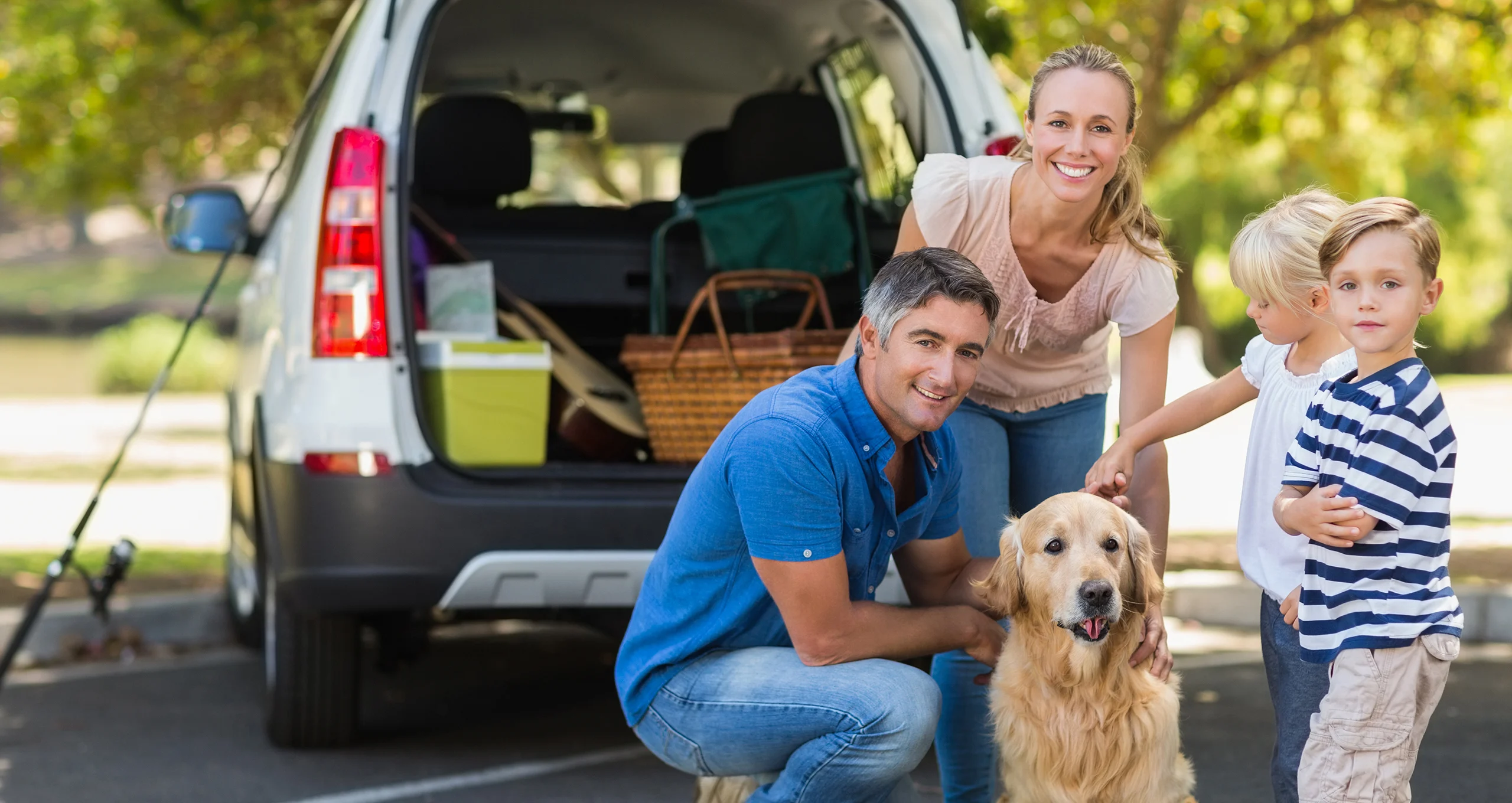 h family with golden retreiver by car