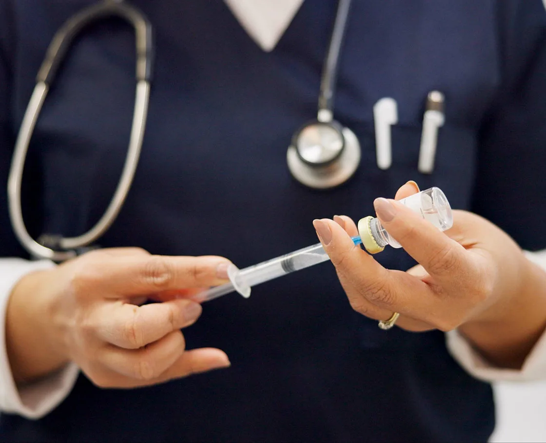 veterinary internal medicine tech with syringe