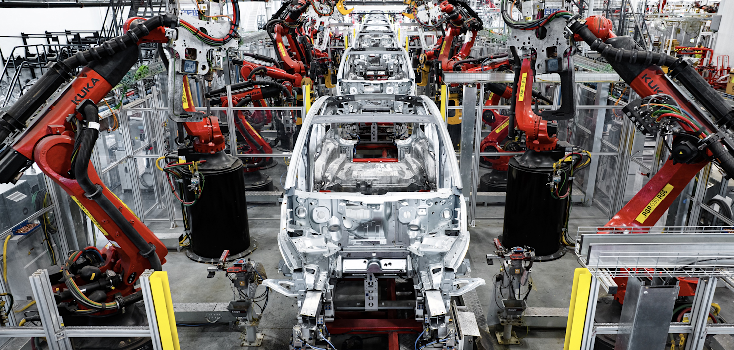 Robots building teslas