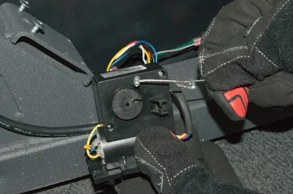 PHOTO: Remove the cable from the motor pulley.