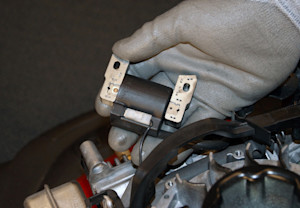 Lift the ignition coil up.