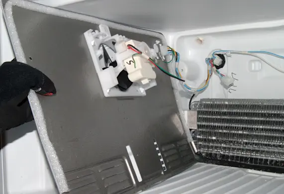 PHOTO: Push the evaporator cover to the side.