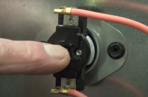 How to reset the thermal switch in a wall oven