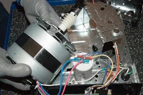 PHOTO: Reinstall the motor.