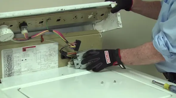 PHOTO: Remove the timer from the control panel.