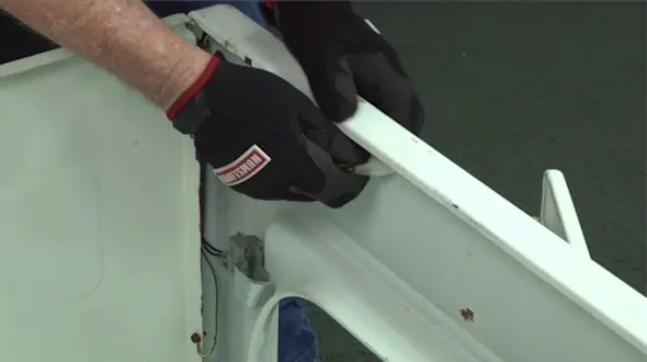 PHOTO: Pull out the lid switch wire harness plug.