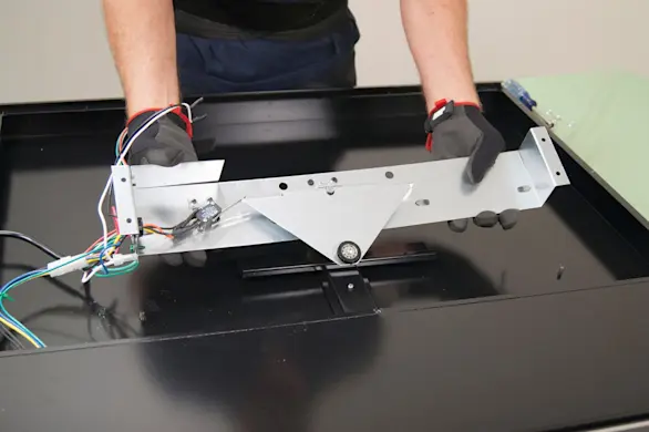 PHOTO: Flip the gear motor bracket over.