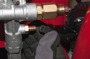 PHOTO: Pull the chemical injection hose off of the valve.
