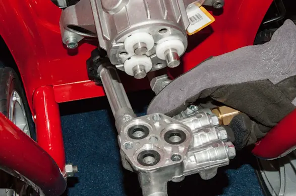 PHOTO: Remove the manifold from the pump.