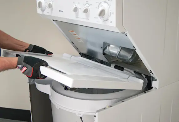 PHOTO: Reinstall the top washer panel.