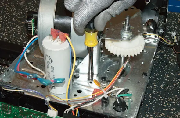 PHOTO: Replace the chain-drive motor mounting screws.