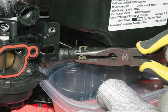 PHOTO: Reconnect the fuel line to the tank.