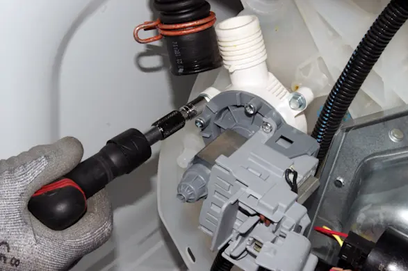PHOTO: Remove the drain pump bolts.