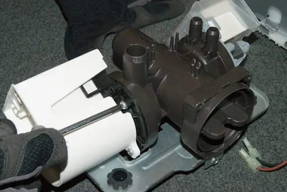 PHOTO: Install the new drain pump into the pump body.