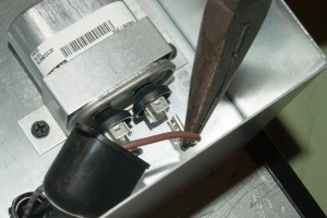 PHOTO: Connect the motor capacitor wires.