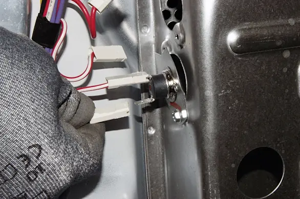 PHOTO: Remove the wires from the thermal cut-off fuse.