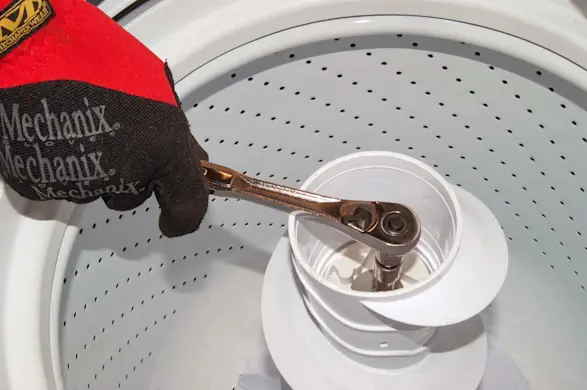 PHOTO: Remove the bolt from the agitator.