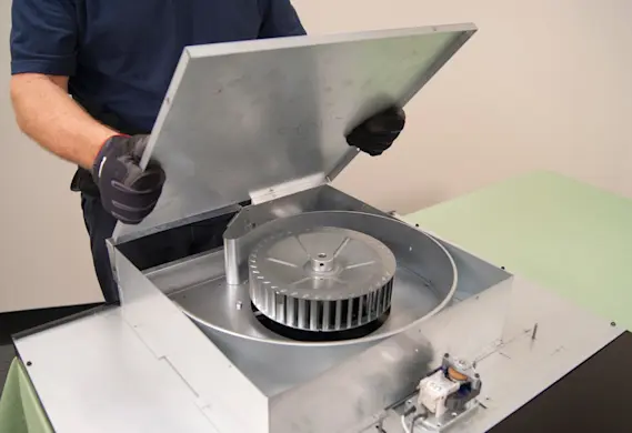 PHOTO: Reinstall the blower housing cover.