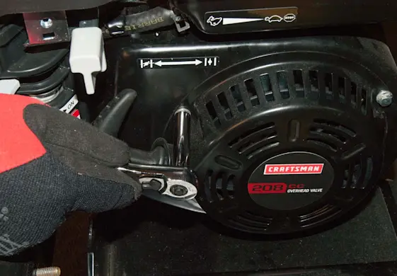 PHOTO: Reinstall the recoil starter mounting nuts.