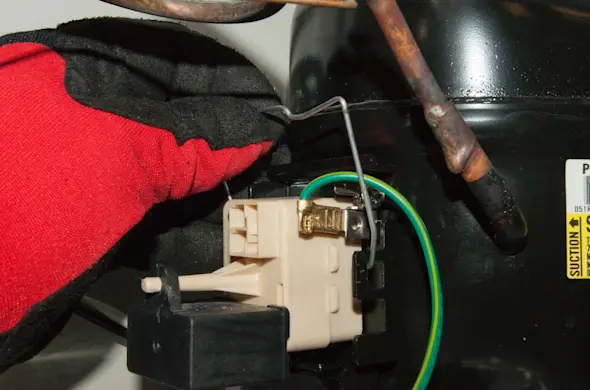 PHOTO: Reinstall the wire retainer.