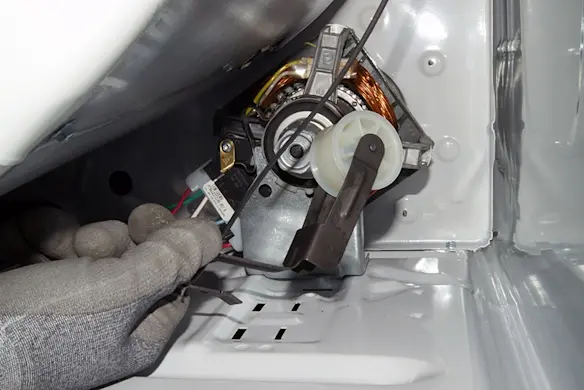 PHOTO: Remove the idler pulley from the dryer.