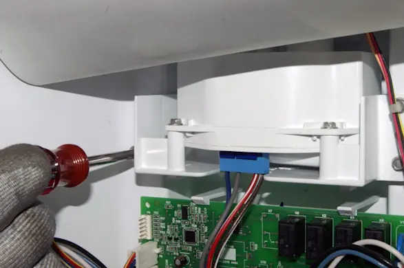 PHOTO: Remove the motor mounting screws.