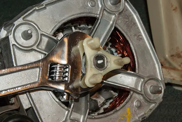 PHOTO: Pry the cog off of the motor shaft.