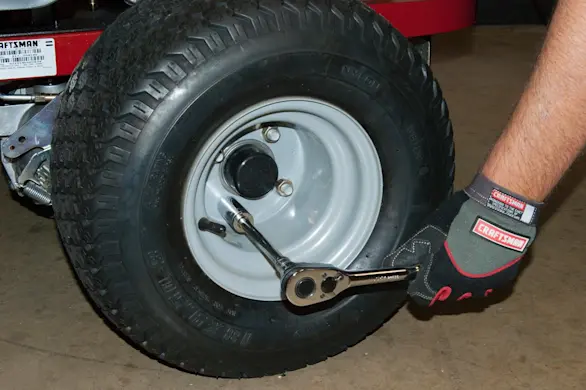 PHOTO: Loosen the lug nuts.