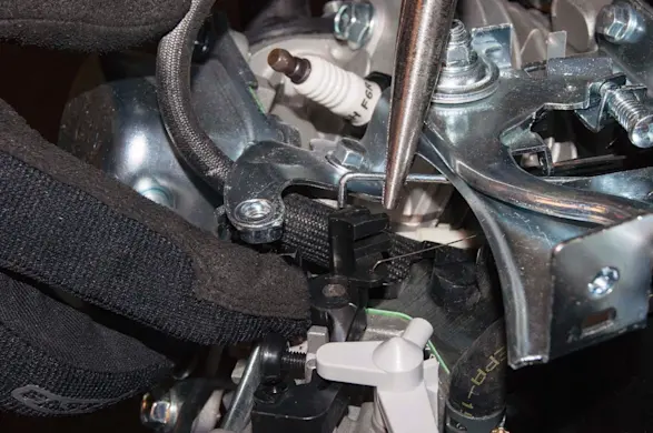 PHOTO: Reconnect the throttle linkage.