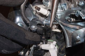 PHOTO: Reconnect the throttle linkage.