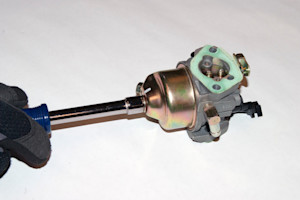 Remove the fuel bowl nut.