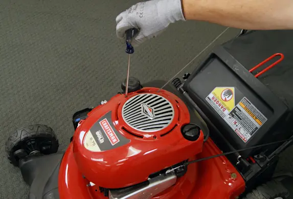 PHOTO: Remove the engine cover.