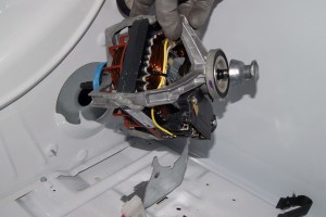 PHOTO: Remove the drive motor from the dryer.