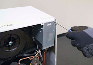 Remove the screw from the control box.