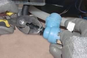 PHOTO: Remove the dishwasher water inlet valve.